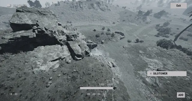 SILOTOWER camera, Missile Silo: a rocky outcrop and open ground, seen from high above